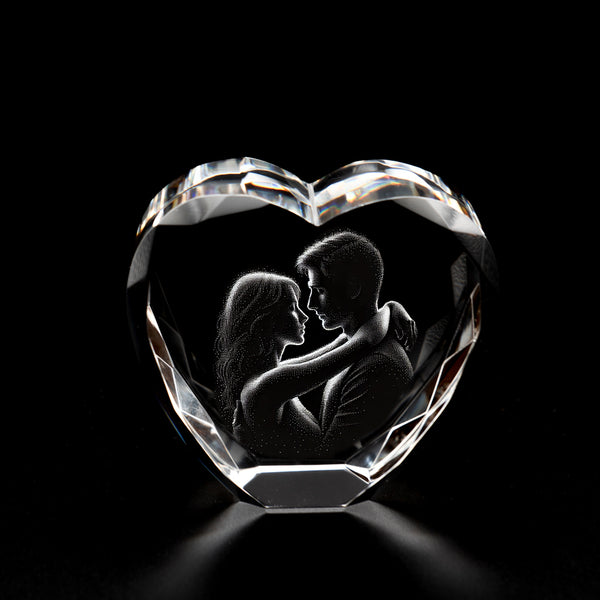 A custom 3D crystal engraving of a couple in a heart-shaped crystal.